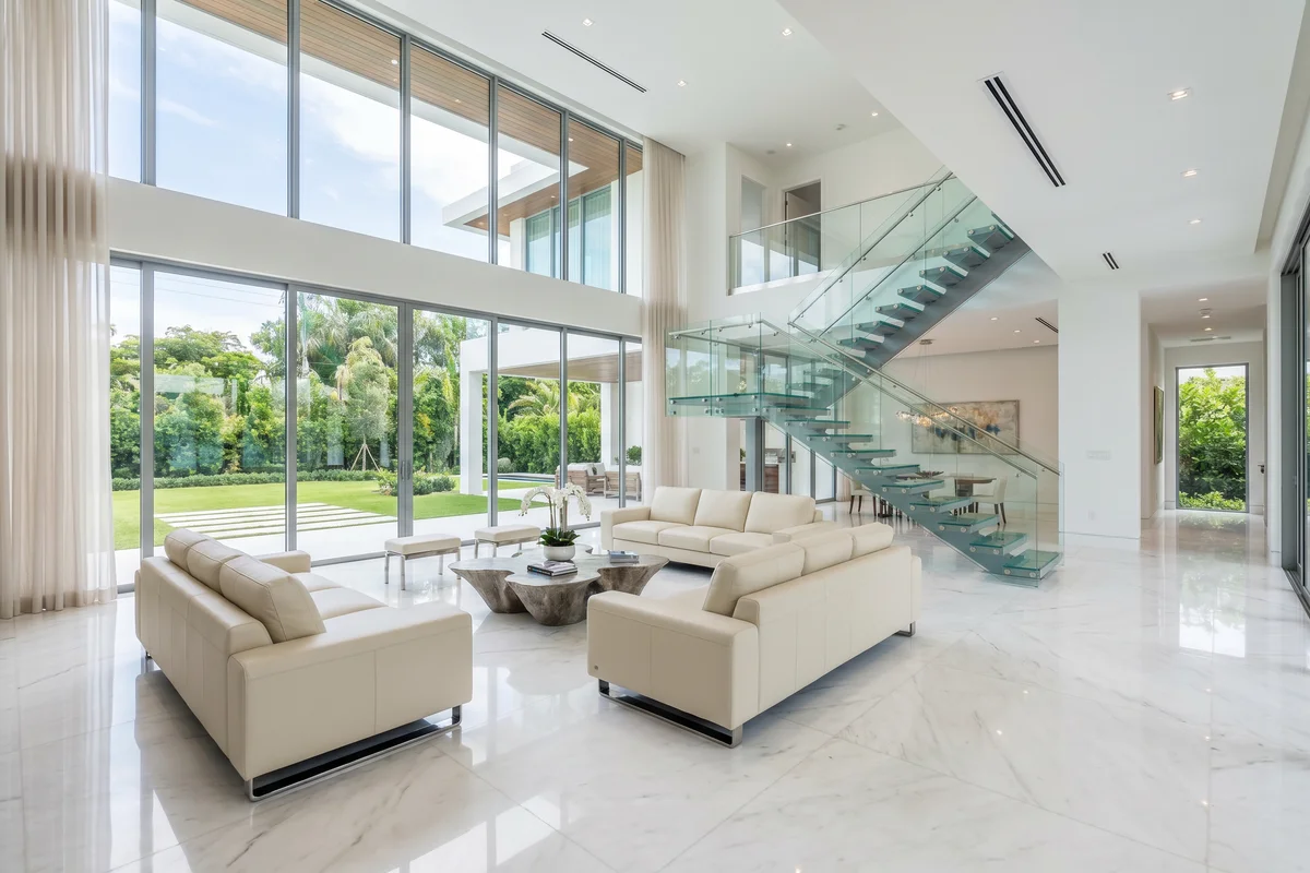 Pristine polished marble floors in a modern open-concept living room